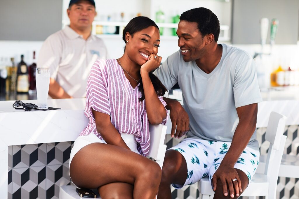 Couple hanging out by the bar